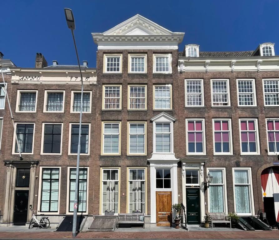 a large brick building with lots of windows at B&B Montancourt-Middelburg in Middelburg