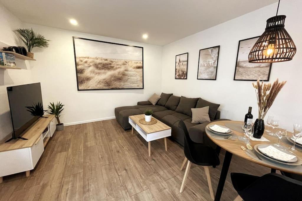 a living room with a couch and a table at AR Apartments III I 4 Pers I Modern I Schillerapartment in Rudolstadt