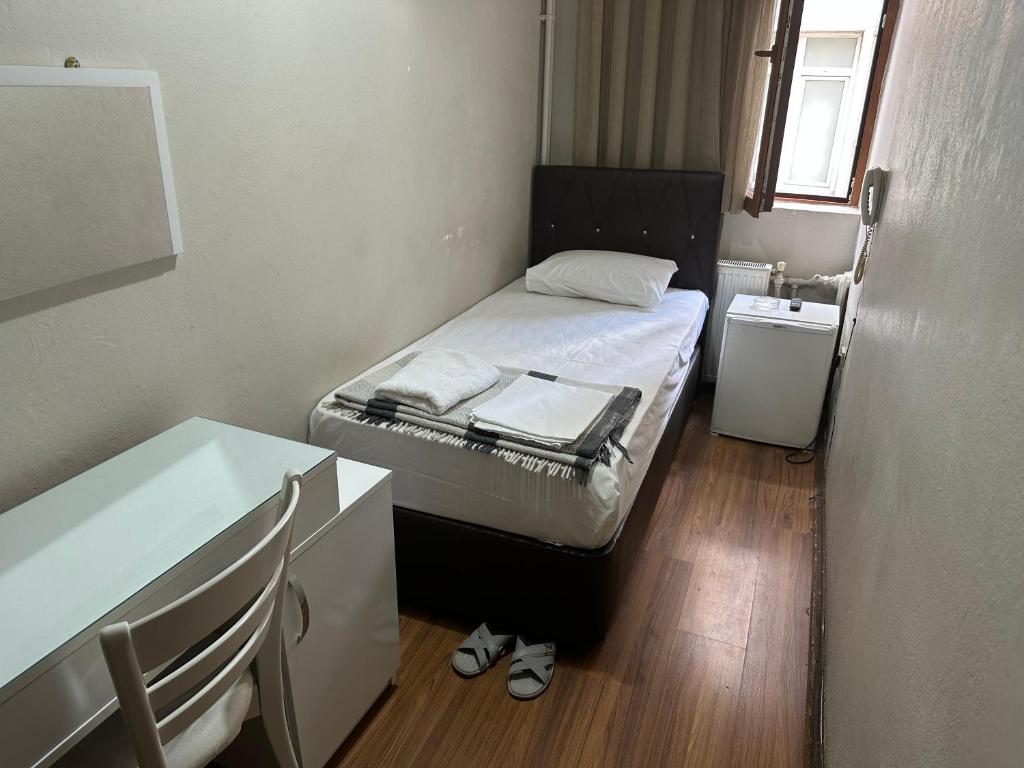 A bed or beds in a room at Hotel Hoyuk