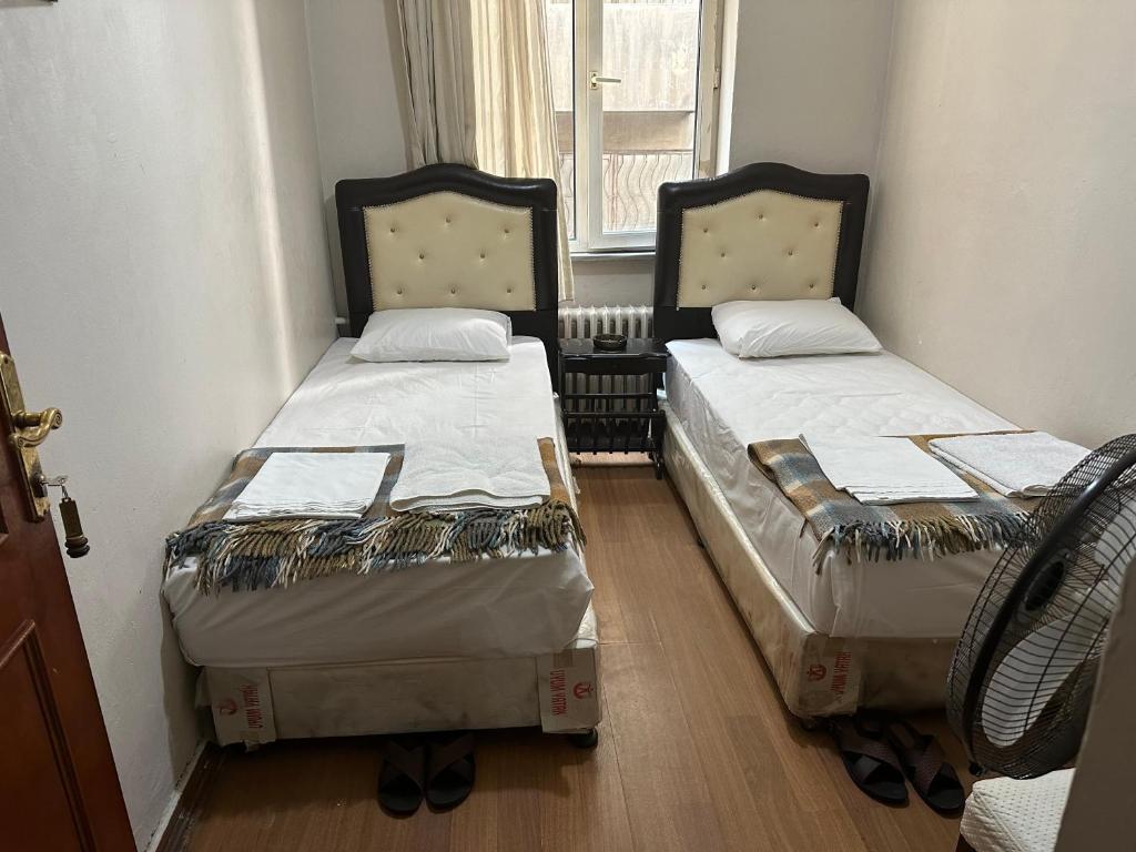 A bed or beds in a room at Hotel Hoyuk