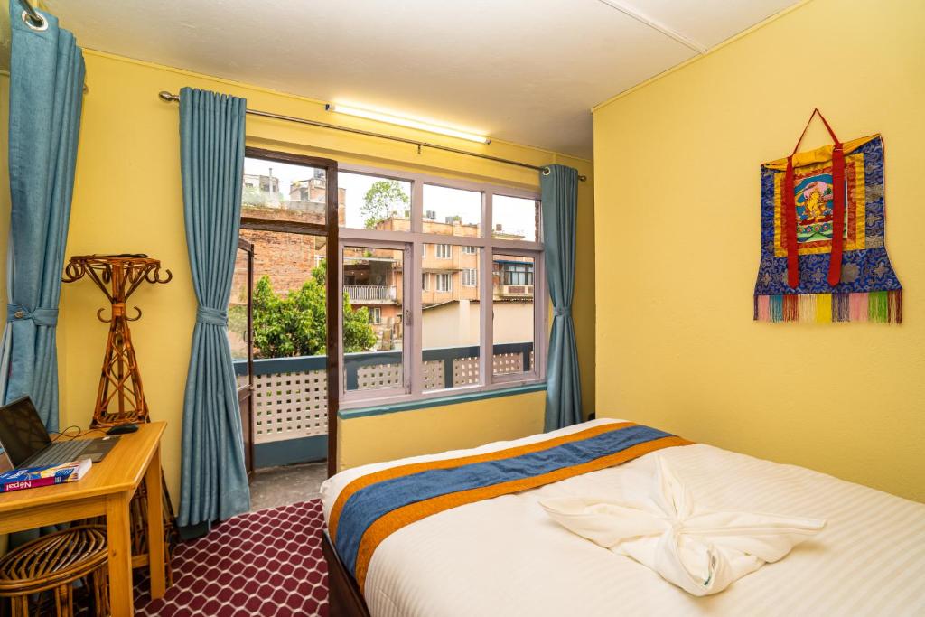 Postel nebo postele na pokoji v ubytování Kwabahal Boutique Hostel