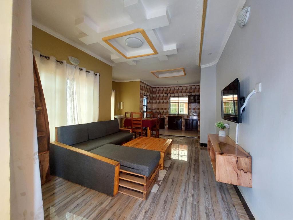 a living room with a couch and a table at Maili 6 Private Apartments in Moshi