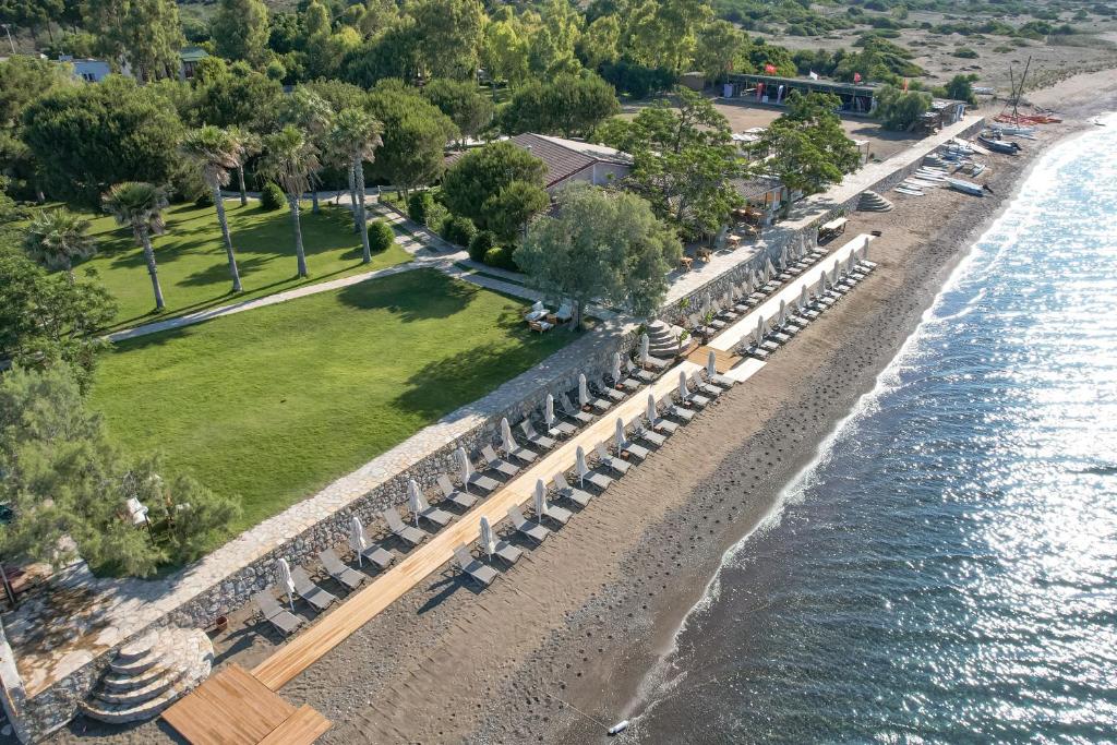 an overhead view of a beach with tables and chairs at Datça Dirik Surf Beach Hotel in Datca