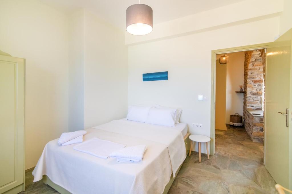 Postel nebo postele na pokoji v ubytování ReGenesis Villas