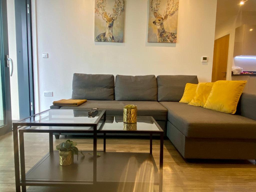 a living room with a couch and a coffee table at Stunning & Luxury Flat in Sutton