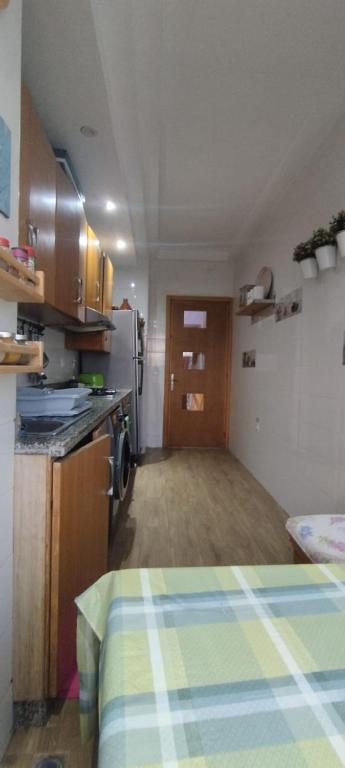 Kuchyň nebo kuchyňský kout v ubytování Chambre haut standing