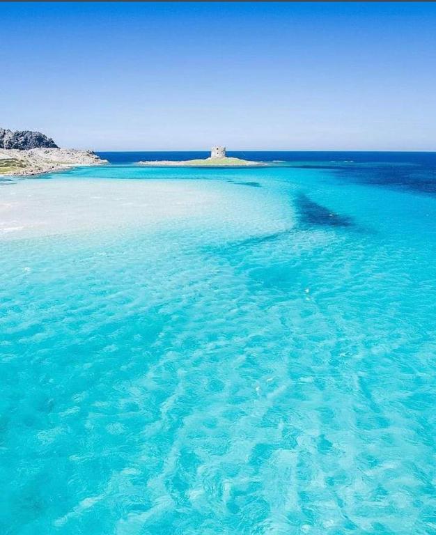 an island in the ocean with blue water at Mare e Montagna in Bonarcado