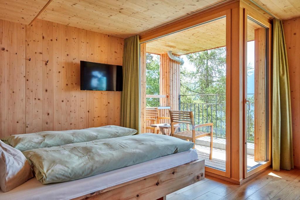 Postel nebo postele na pokoji v ubytování Hotel Waldhaus
