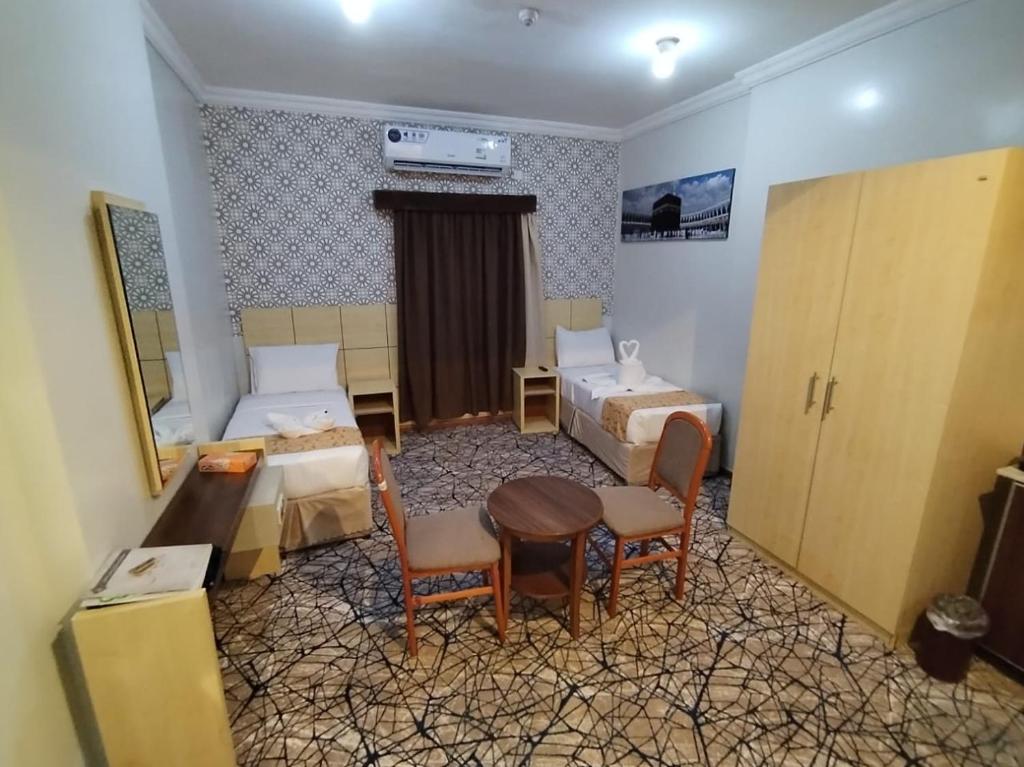 Postel nebo postele na pokoji v ubytování فندق سفير المسك Safeer Almisk Hotel
