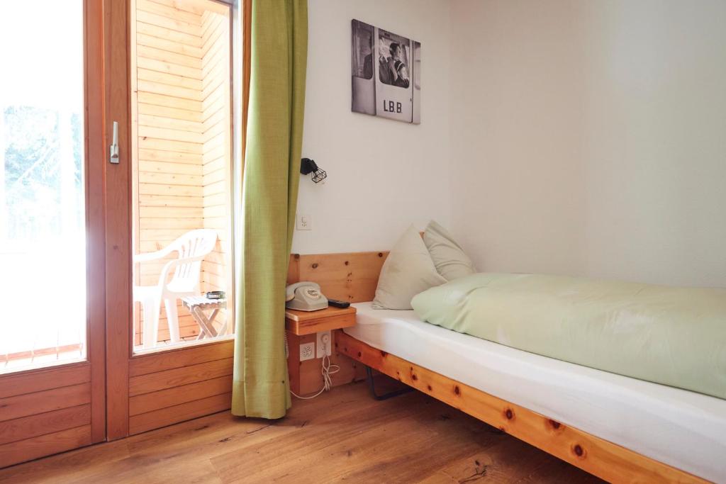 Postel nebo postele na pokoji v ubytování Hotel Waldhaus