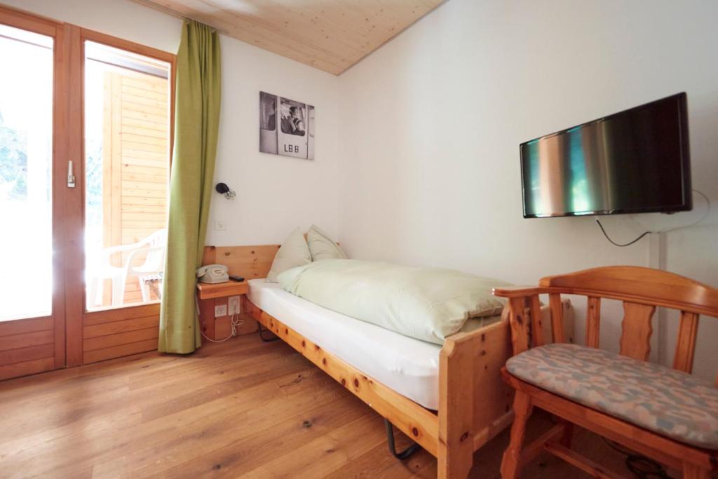 Postel nebo postele na pokoji v ubytování Hotel Waldhaus