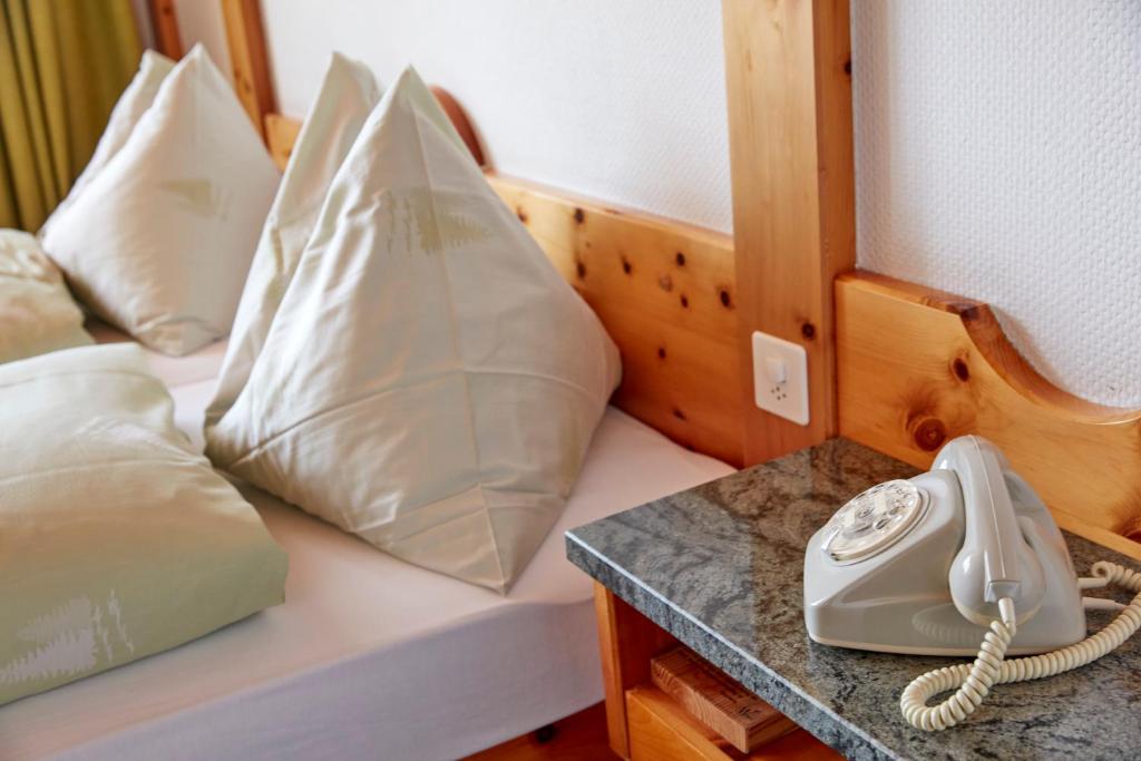 Postel nebo postele na pokoji v ubytování Hotel Waldhaus