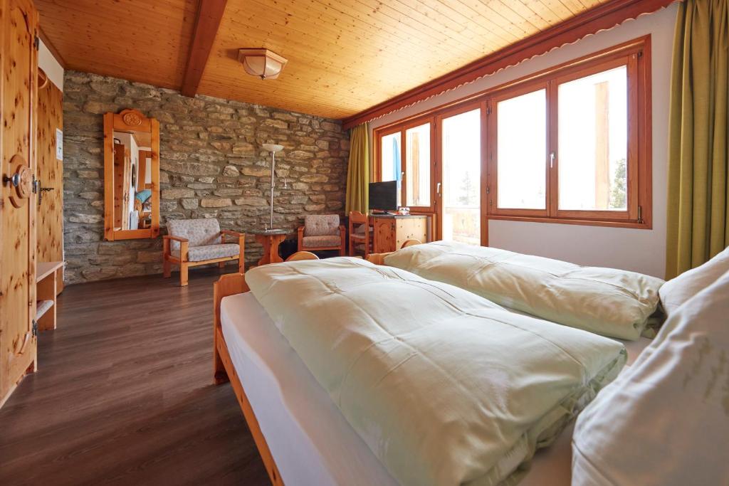 Postel nebo postele na pokoji v ubytování Hotel Waldhaus
