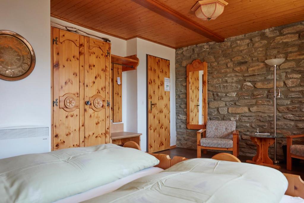 Postel nebo postele na pokoji v ubytování Hotel Waldhaus