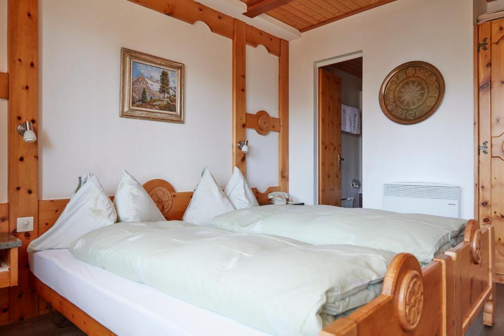 Postel nebo postele na pokoji v ubytování Hotel Waldhaus