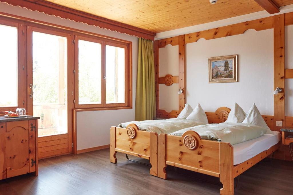 Postel nebo postele na pokoji v ubytování Hotel Waldhaus