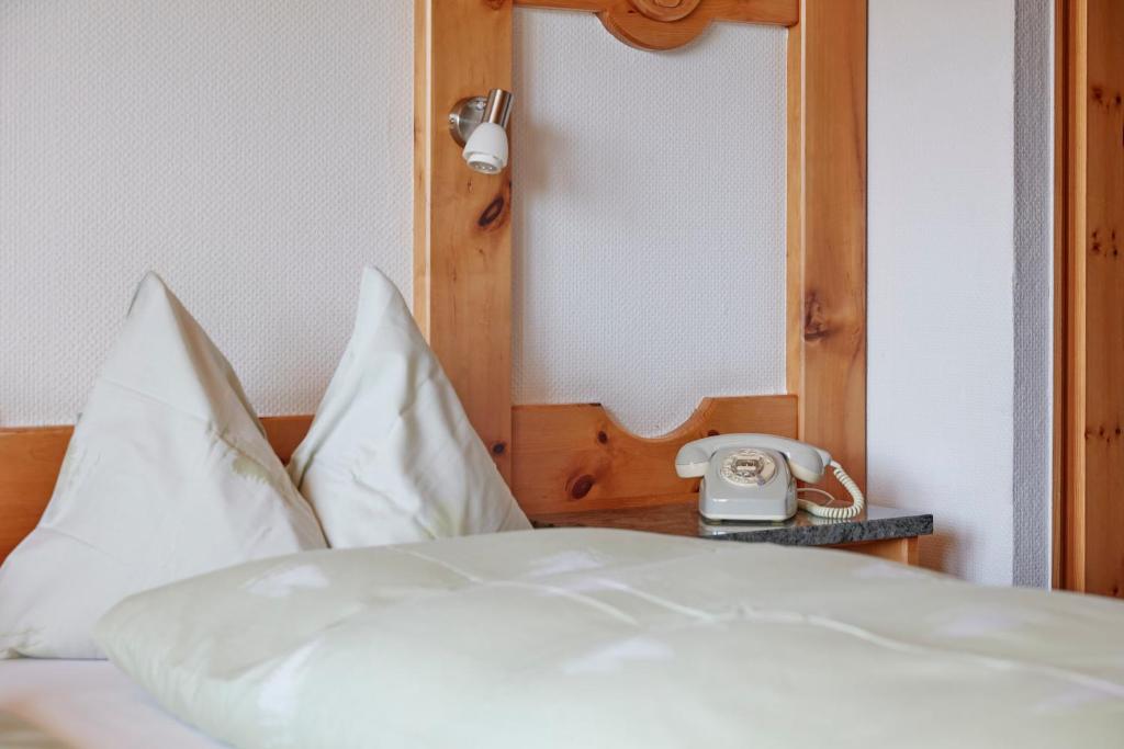 Postel nebo postele na pokoji v ubytování Hotel Waldhaus