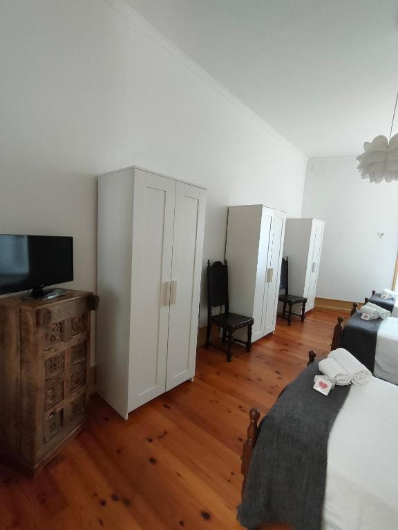 Postel nebo postele na pokoji v ubytování A Vianesa - Guest House