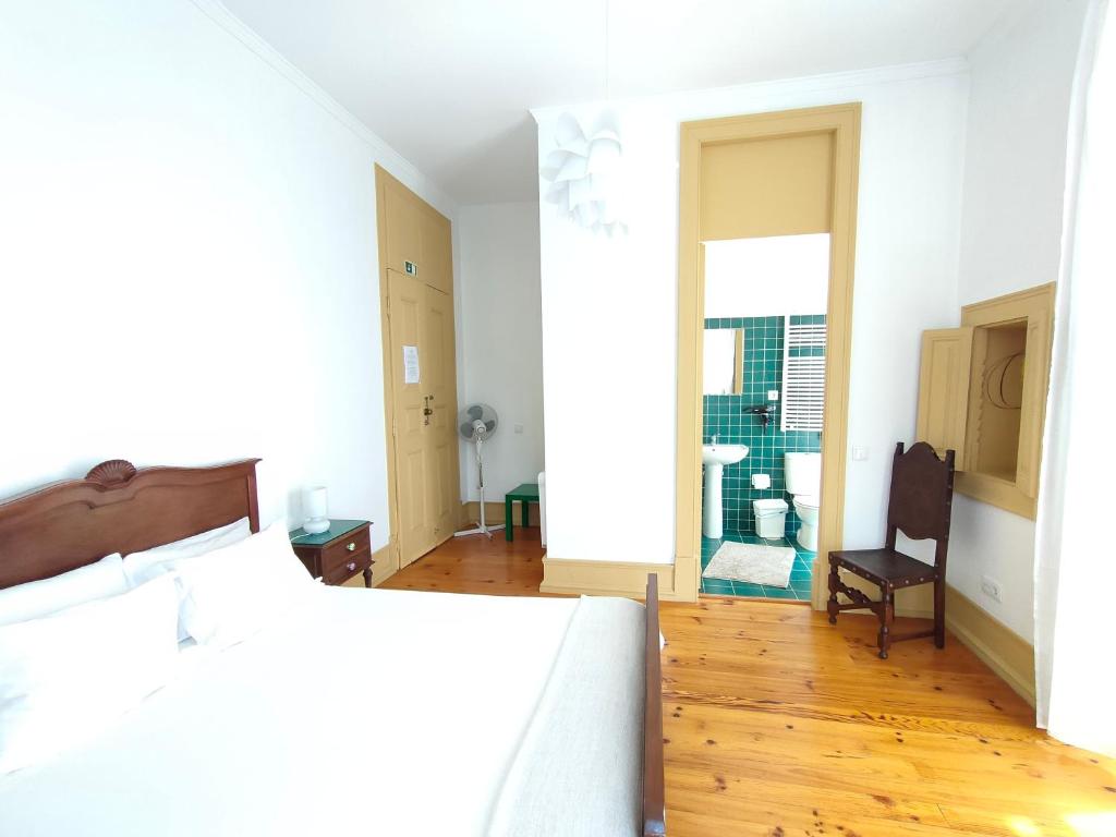 Postel nebo postele na pokoji v ubytování A Vianesa - Guest House