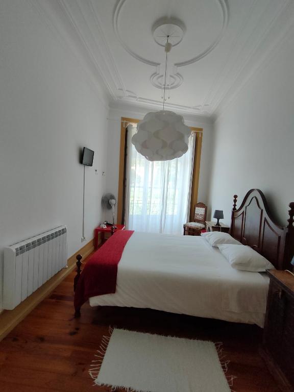 Postel nebo postele na pokoji v ubytování A Vianesa - Guest House