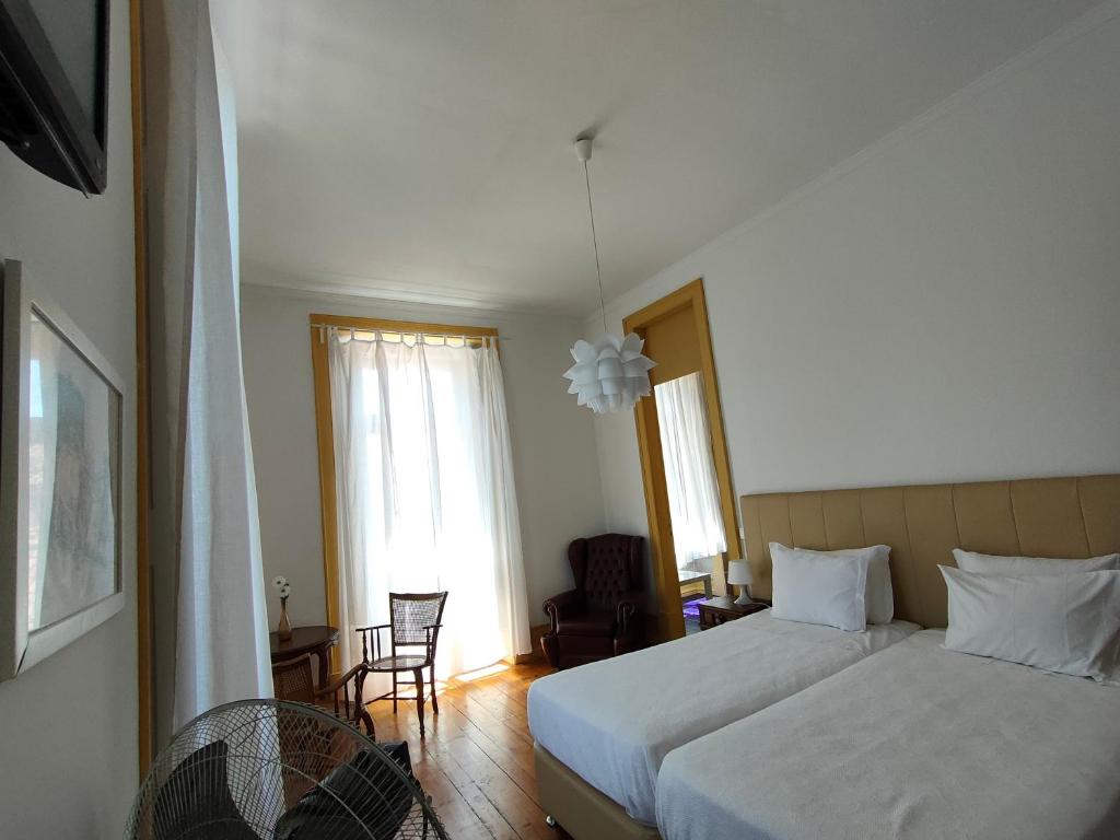 Postel nebo postele na pokoji v ubytování A Vianesa - Guest House