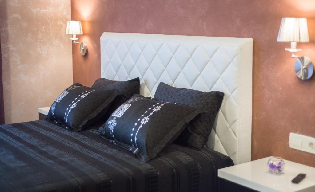 Postel nebo postele na pokoji v ubytování Hotel Mostar