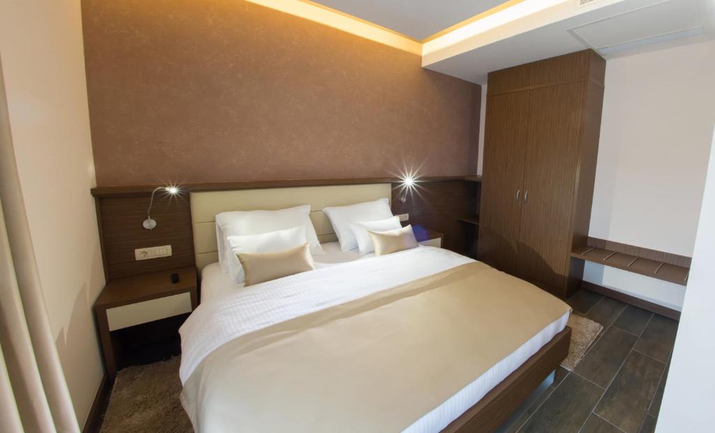 Postel nebo postele na pokoji v ubytování Hotel Mostar