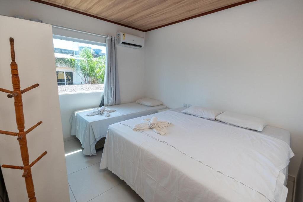 Cama ou camas em um quarto em Brisa do Caitá Praia Hotel