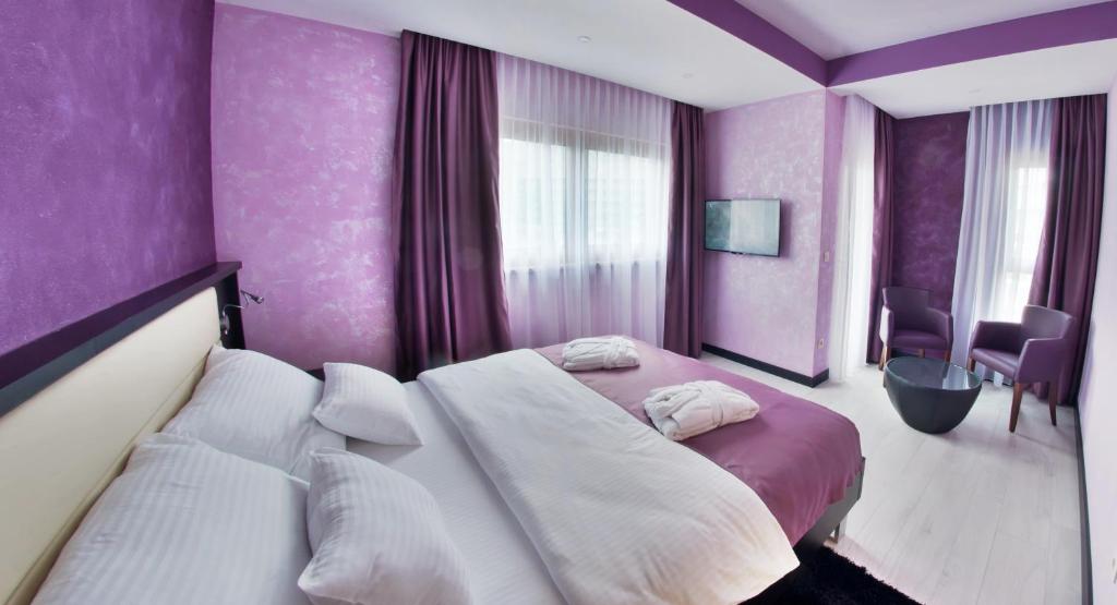Postel nebo postele na pokoji v ubytování Hotel Mostar