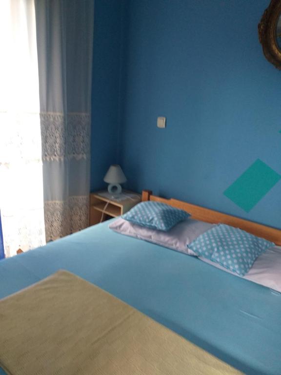 Voodi või voodid majutusasutuse Vila Dalmatinka toas