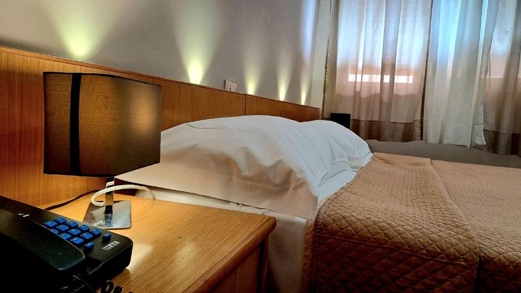 Postel nebo postele na pokoji v ubytování Hotel Del Viale