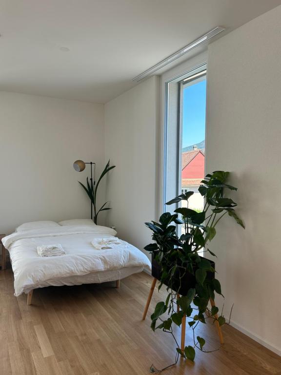 Postel nebo postele na pokoji v ubytování The R Apartment Passwang, KLIMA, NEU, Balkon, Parking