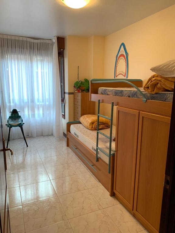 Postel nebo postele na pokoji v ubytování piso en la playa