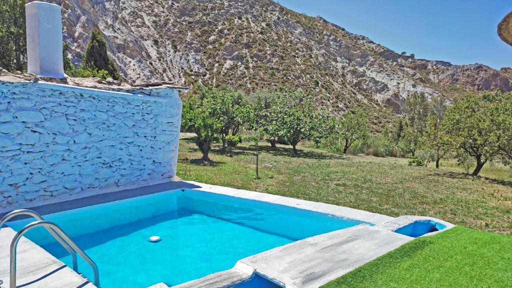The swimming pool at or close to Cortijo AguaChá