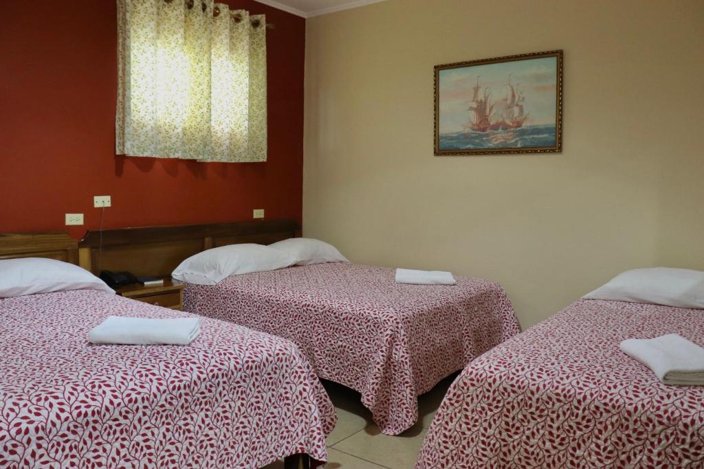 Postel nebo postele na pokoji v ubytování Hotel Residencial Panamericano