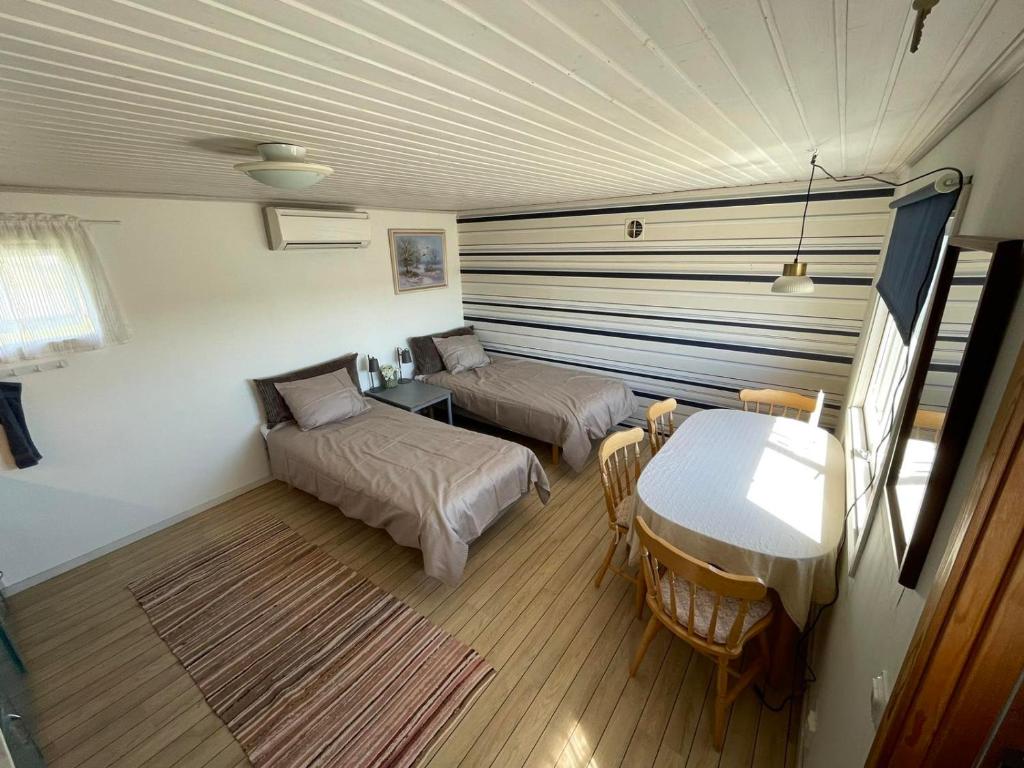 Ένα ή περισσότερα κρεβάτια σε δωμάτιο στο Cozy cottage stay