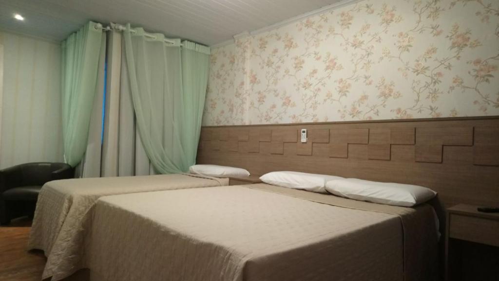 Postel nebo postele na pokoji v ubytování Beto´s Pousada