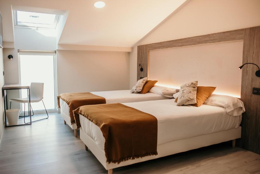 Кровать или кровати в номере Hotel Lux Melide