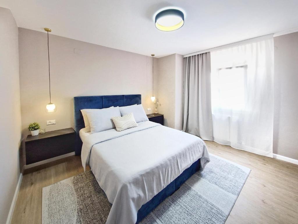 Кровать или кровати в номере Apartments Jasna