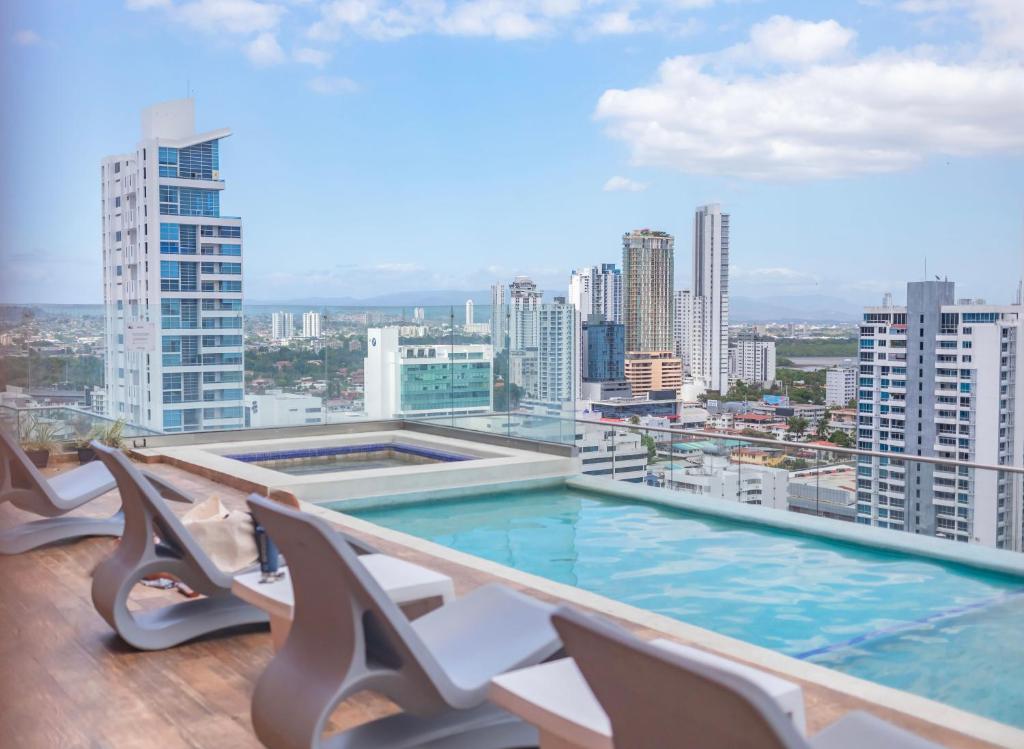 a balcony with a swimming pool on top of a building at Boutique Apartments Panama Atlapa in Panama City