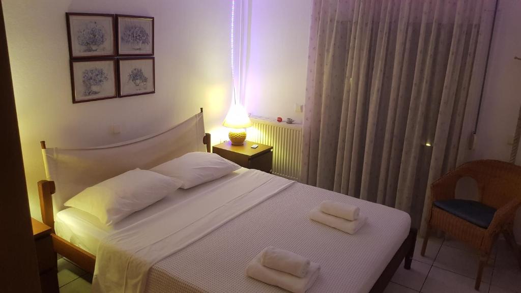 Postel nebo postele na pokoji v ubytování Villa Georgia Poseidi