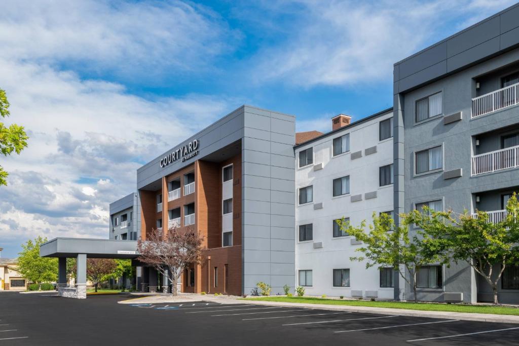 a rendering of the courtyard hotel in a city at Courtyard by Marriott Reno in Reno