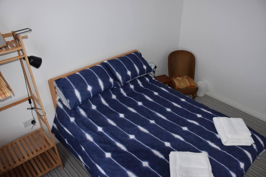 Säng eller sängar i ett rum på Cosy Coastal Cottage in Portballintrae