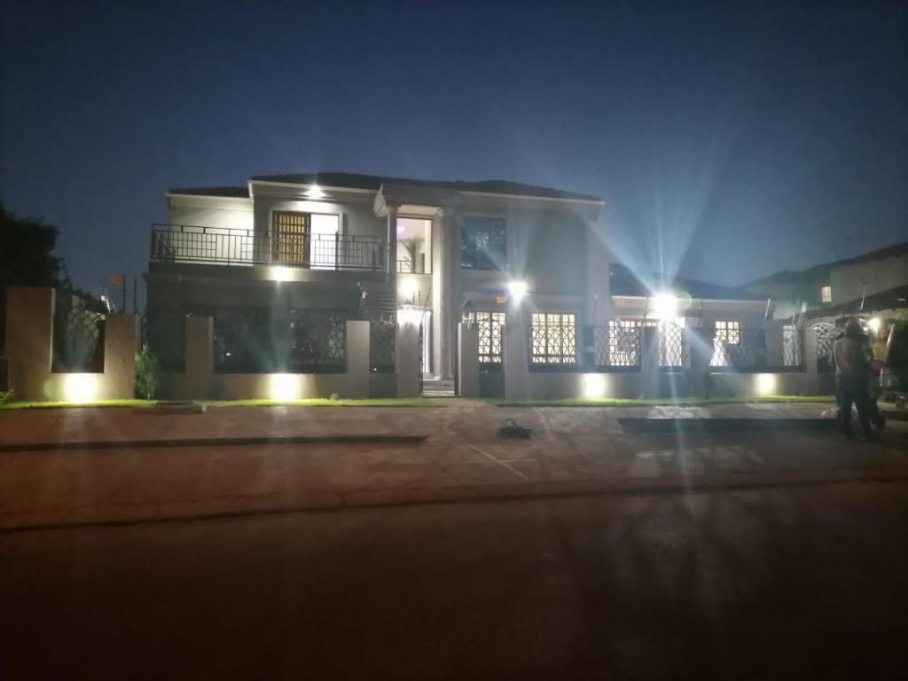 una casa con luces delante de ella por la noche en Lady D Exclusive Abode, en Polokwane