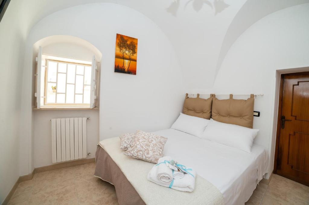 Postel nebo postele na pokoji v ubytování Casa GianAngel Ostuni