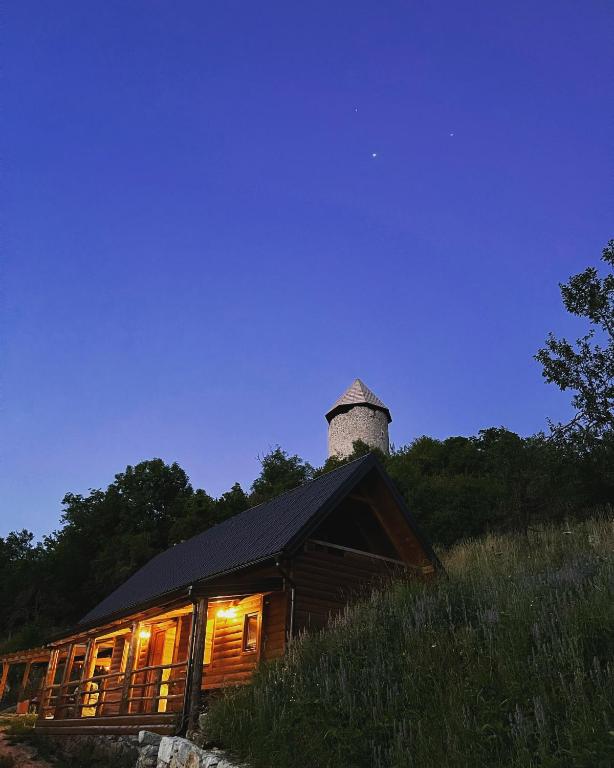 a building with a chimney on top of it at Koliba 30svibnja in Perušić