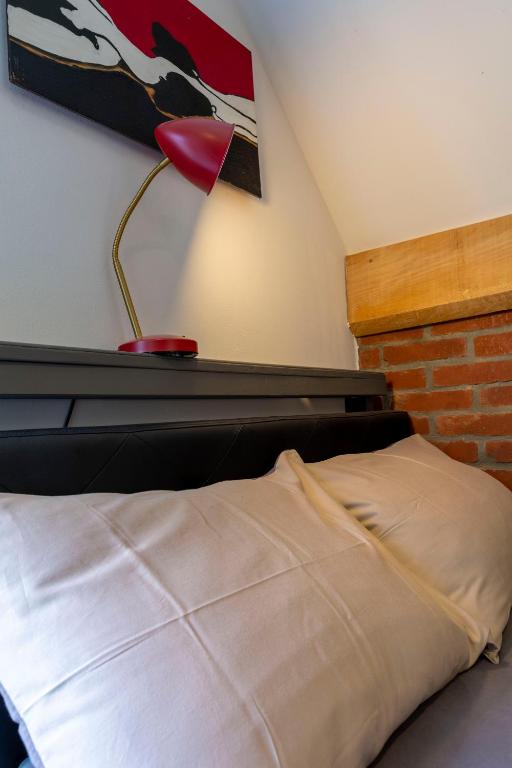 Postel nebo postele na pokoji v ubytování BnB Comfort Guesthouse Olten - Lostorf