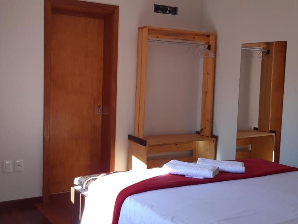 Postel nebo postele na pokoji v ubytování Recanto Ninho das Aguias