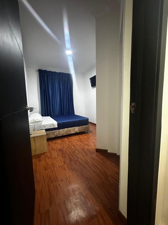 Postel nebo postele na pokoji v ubytování Hotel Artistico