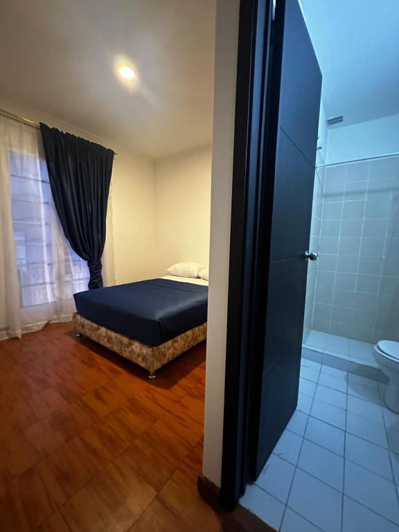 Postel nebo postele na pokoji v ubytování Hotel Artistico